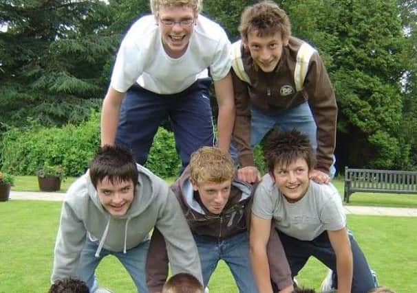 Harry pictured with friends having fun at school. Picture submitted.