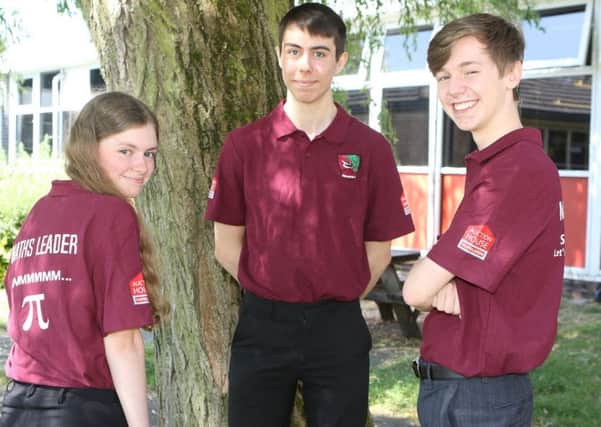 Brookfield School Maths Leaders, Millie Wright, Harry Berresford and Harrison Dart showing off the new maths leader shirts sponsored by Copelands Auction House