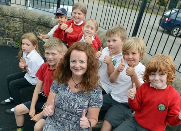 Edale primary school Ofsted. Headteacher Nancy Lees with pupils celebrate.