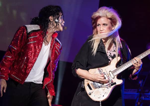 Navi And Jennifer Batten during aMichael Jackson King Of Pop concert.