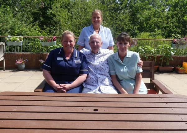 Peter Stockton with carers at Ashgate Hospice.