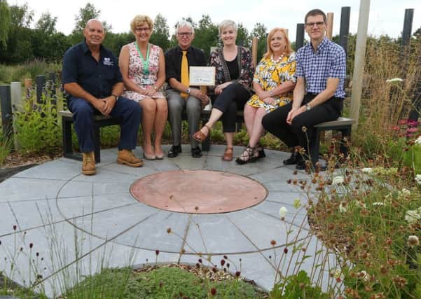 Dave Sanderson of the Royal's grounds team, Susan Sanderson of Macmillan,Vernon Sanderson of the NGS, Designer Lara Behr, Christine Sanderson of the NGS and Consultant Roger Start from the NGS Macmillan Unit