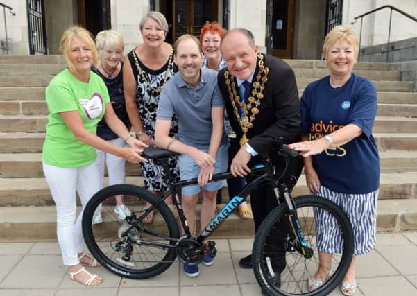 Pictured is Lynn Jones, of Ashgate Hospicecare, parish councillor Sue Bean, Chesterfield Mayoress Anne Brittain, JE Jamess Dean Poole, Chesterfield Mayor Stuart Brittain, fundraising team member Shirley Niblock and Chesterfield Citizens Advice Bureau chairman Linda Moore with a JE James bike donation for the Mayors Charity.