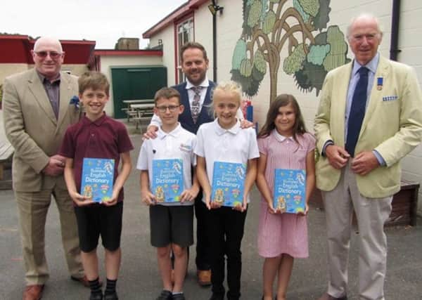 Chesterfield Rotarians Geoff Mitchell and Peter Barr, with Dunston headteacher Mr Burgess, and pupils, head boy Thomas and head girl Grace, along with their deputies Alex and Jodie.