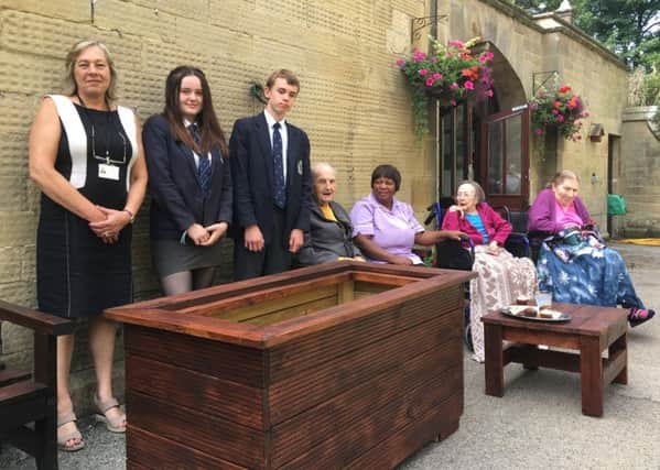 Lady Manners School pupils create garden furniture for Burton Closes Care Home, Bakewell.
