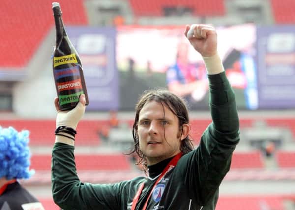 Chesterfield FC at Wembley v Swindon Town. Tommy Lee with champagne