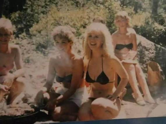 Sharon relaxing on the beach with other air hostesses.