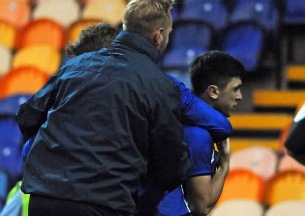 Mansfield Town v Sheffield Wednesday.
Forestieri is shepherded off the pitch.