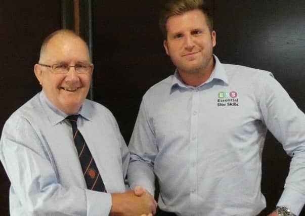 New sponsor Gareth Davies is welcomed by Tony Barton, of the league.
(PHOTO BY: Martin Roberts)
