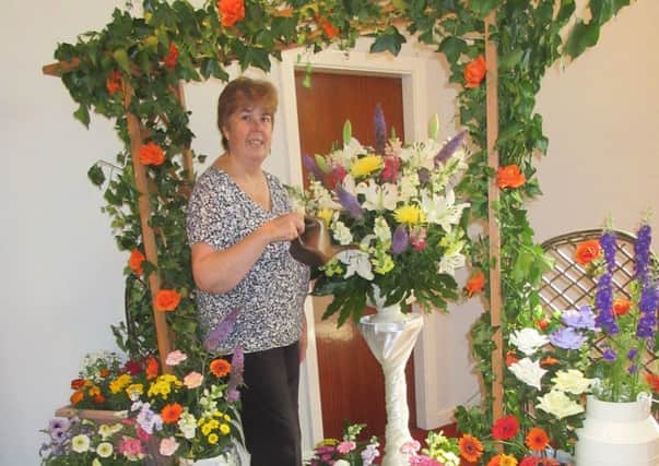 Caroline Dellow with her English country garden display at Alfreton Wesley Church.