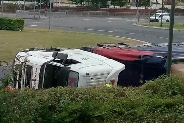 The overturned lorry at Horns Bridge roundabout.