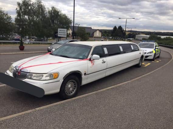 The limo outside the designer outlet.