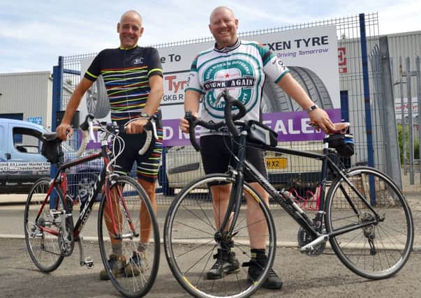 Chris Miller is taking part in a charity bike ride raising money for Cancer Research, pictured from from left Chris Wood with Chris Miller