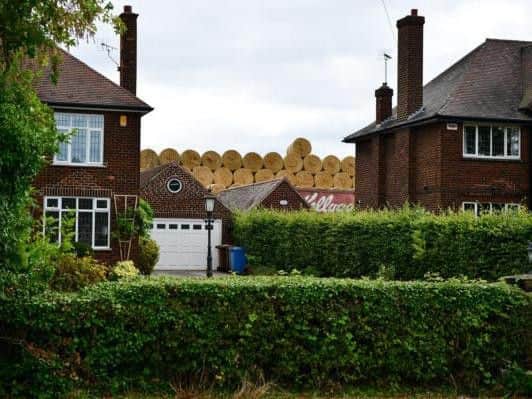 The 30 foot high stacks were left in a field adjacent to the back gardens of residents' homes (Photo: SWNS)