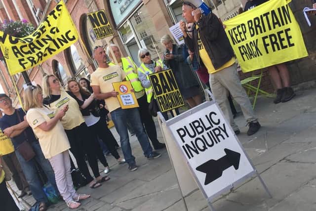 Campaigners outside the public inquiry.