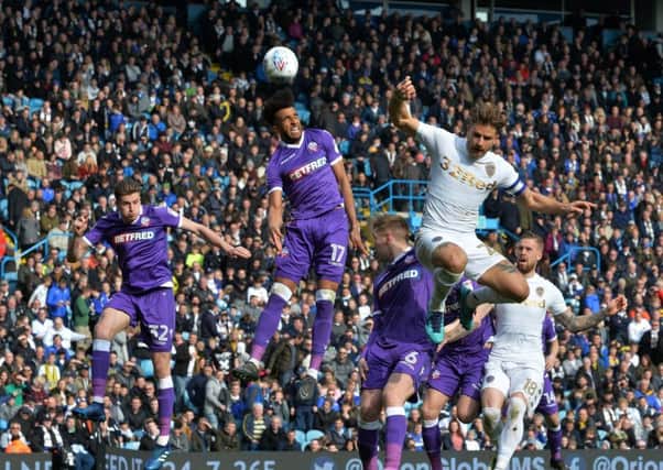 Derik Osede Prieto beats Eunan O'Kane to a corner ball.
Leeds United v Bolton Wanderers.  SkyBet Championship.  Elland Road.
30 March 2018.  Picture Bruce Rollinson