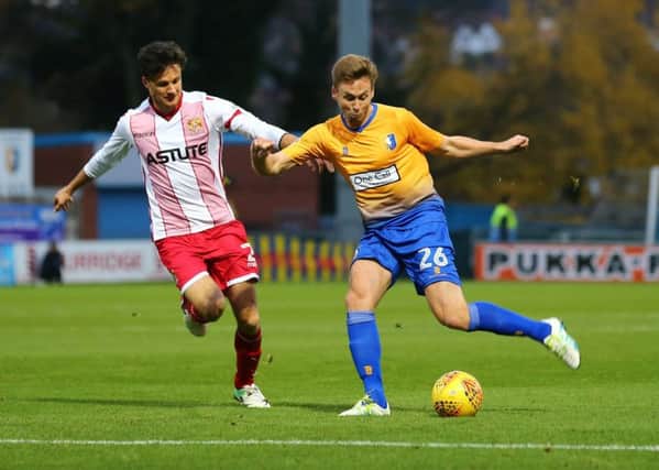 Joel Byrom of Mansfield Town wins the ball against Jonathan Smith of Stevenage during the Sky Bet League 2 match between Mansfield Town and Stevenage at the One Call Stadium, Mansfield, England on 18 November 2017. Photo by Leila Coker / PRiME Media Images.
