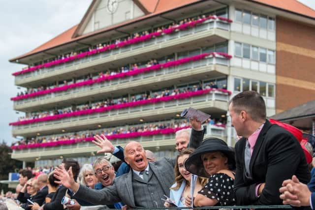 Spectators in a happy mood during the Ebor Festival at York last week (PHOTO BY: James Hardisty)