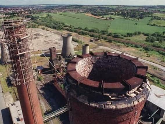 This picture, taken in 1999, shows two 250-foot chimneys at the Avenue site which have since been demolished.