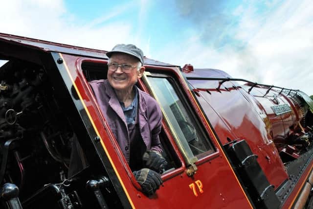 Fireman, John Lowe on the Duchess of Sutherland test run along the Midland Railway line.