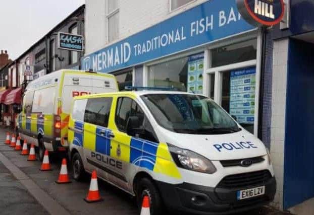 Police outside the Mermaid Fish Bar, which used to be owned by Andy Star, last year.