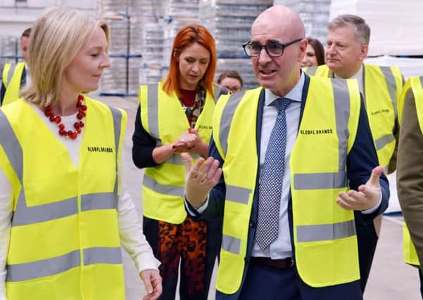 Chief Secretary to the Treasury Liz Truss visits Global Brands warehouse in Claycross. Liz Truss in discussion with Steve Perez chairman Global Brands.