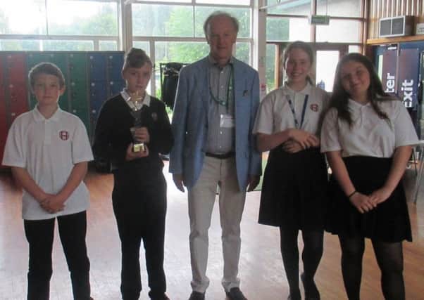 David Allen from Twiggs presents the Twiggs Trophy to Year 8 students.