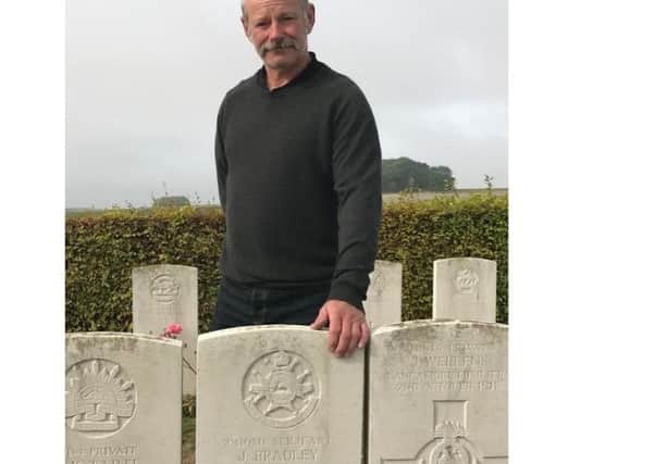 Mark Parry at his great uncle's grave, Tincourt Cemetery.