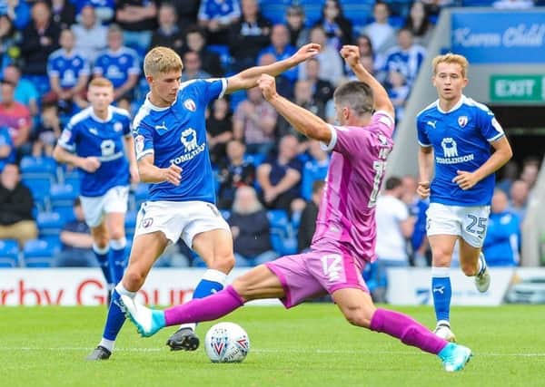 Chesterfield's midfielder Charlie Wakefield (16) cuts outside Grimsby Town's defender Zak Mills (12).

Picture by Stephen Buckley/AHPIX.com. Football, League 2, Chesterfield v Grimsby Town; 05/08/2017 KO 3.00pm 
Proact; copyright picture; Howard Roe; 07973 739229