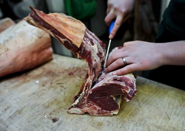Embargoed to 0001 Sunday June 17 Undated file photo of a butcher at work. Fears of contaminated meat entering the food chain because of &quot;failings&quot; at slaughterhouses have been raised by workers in the industry.