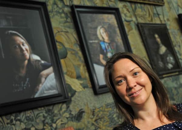 Derbyshire woman Robyn Riggans who set up WORTH (Women On The Road To Healing) sits along side Channel Four broadcaster Cathy Newman in the exhibition.