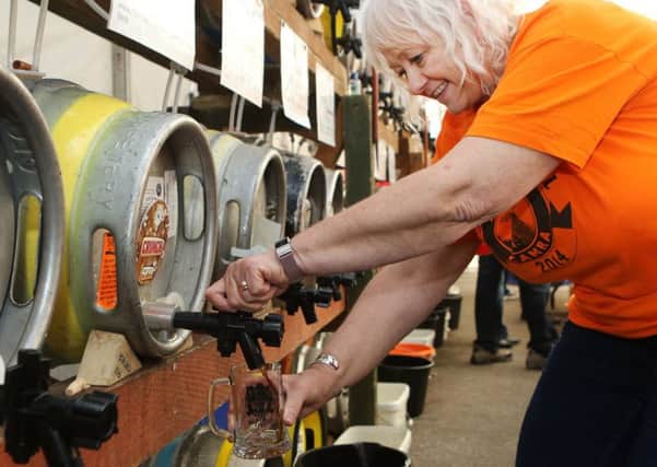 Amber Valley CAMRA beer festival, Wedy Trueman pouring a drink