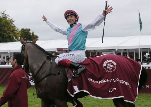 Frankie Dettori celebrates after winning last year's Prix de l'Arc de Triomphe on Enable, who is favourite to repeat her success on Sunday.