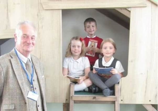 Stephen Wright, chairman of Grassland Hasmoor Big Local Fund, opens the new library at Hasland Infant School.