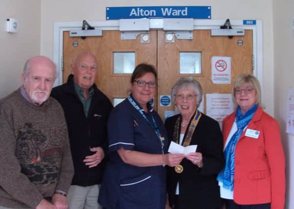 Sally Jackson, president of Clay Cross Rotary Club, presents cheque to Deborah Brailsford, Alton ward manager at Clay Cross Hospital. Looking on are past president Chris Jackson, past president Ray Mountain and Rotarian Sharon Reynolds.