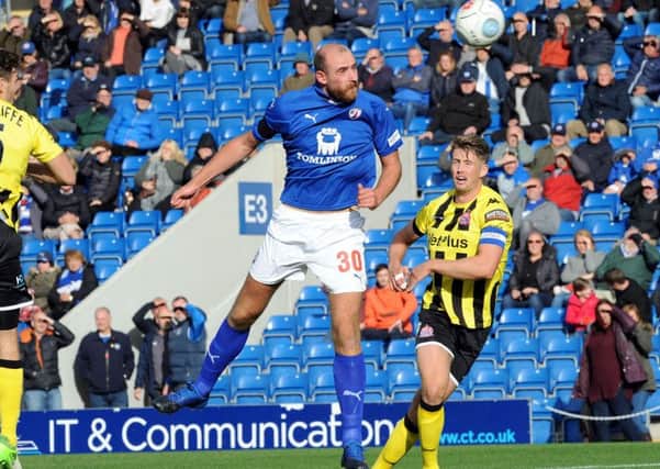 Chesterfield v AFC Fylde.
Tom Denton fires in a header in the first half.