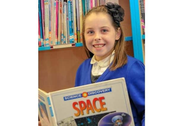 Trinity has some ongoing health problems but says she 'just gets on with it' and loves learning about art and space.