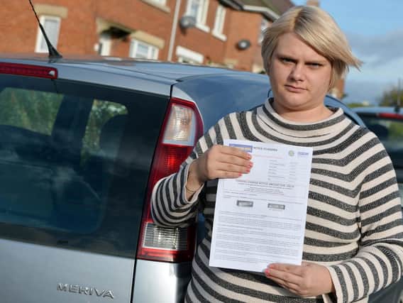 Gayle Stuart with her parking fine. Picture by Brian Eyre.