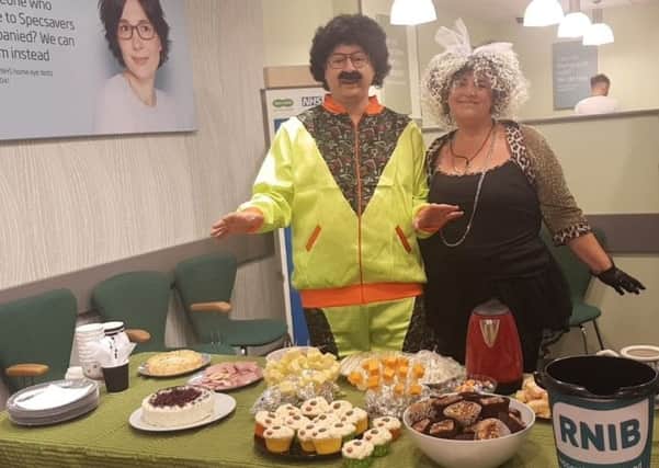 Specsavers staff in Buxton raise money for the RNIB at fancy dress cake bake and tea party.