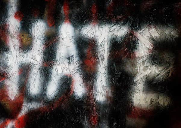 File photo dated 21/03/17 of graffiti on a wall in Bristol. Churches, mosques, temples and gurdwaras can bid for a share of &pound;1 million of Government funding to help protect against hate crimes.