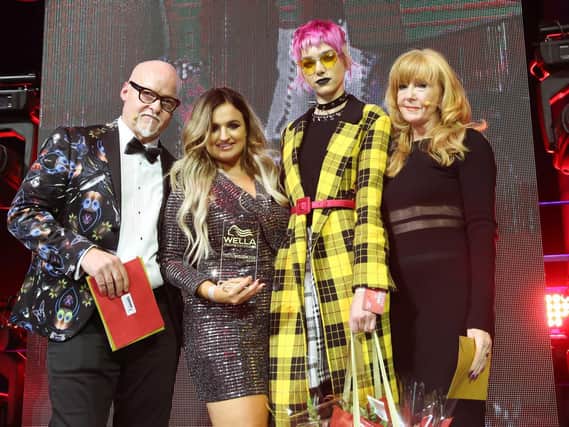 Nikki Clifford, second from left, with her prestigious hairdressing award.