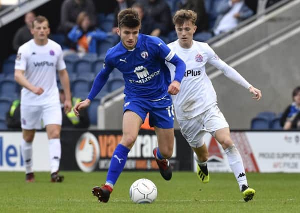 Chesterfield's Joe Rowley runs at the AFC Fylde defence: Picture by Steve Flynn/AHPIX.com, Football: The Emirates FA Cup - Qualifing Fourth Round match AFC Fylde -V- Chesterfield at Mill Farm, Wesham, Lancashire, England on copyright picture Howard Roe 07973 739229