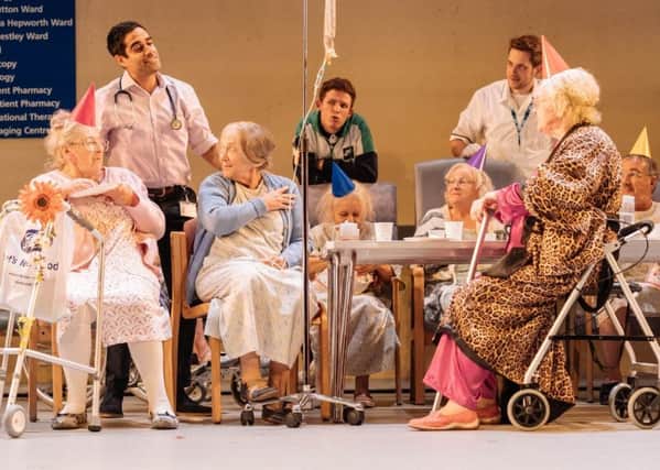 NT Live present Allelujah. Pictured are Patricia England (Mavis), Sacha Dhawan (Dr Valentine), Julia Foster (Mary) and members of the Company of Allelujah! - Photo  by Manuel Harlan.