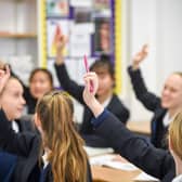 Students raise their hands in class at Royal High School Bath, which is a day and boarding school for girls aged 3-18 and also part of The Girls' Day School Trust, the leading network of independent girls' schools in the UK.