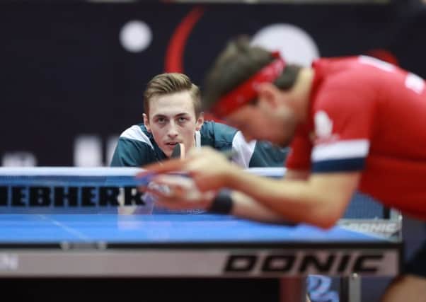 Liam Pitchford in action against Timo Boll. (PHOTO BY: Remy Gros/ International Table Tennis Federation).