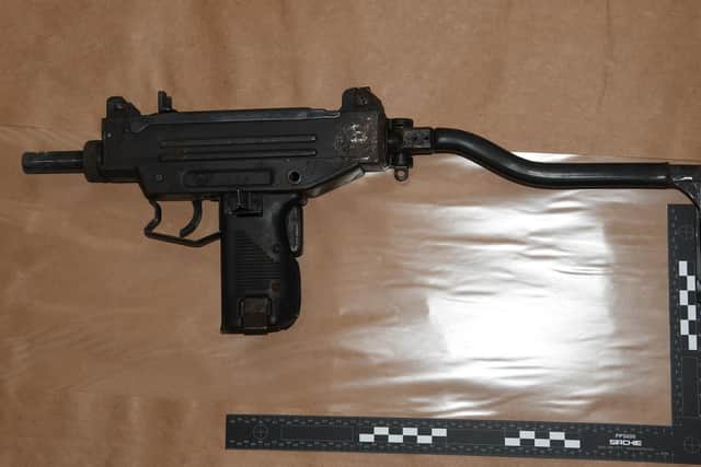 A loaded Uzi submachine gun was found at the property