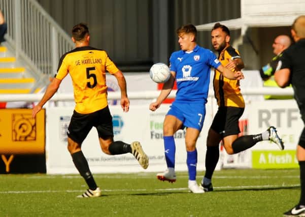Picture by Matt Bristow/AHPIX.com;Football;Vanarama;Conference Premier;
Maidstone United v Chesterfield FC;
29/09/2018  KO 3.00pm; The Gallagher Stadium;
copyright picture;Matt Bristow;07973 739229

Chesterfields midfielder Charlie Carter controls the ball with Maidstone's defender Jack Doyle on his back