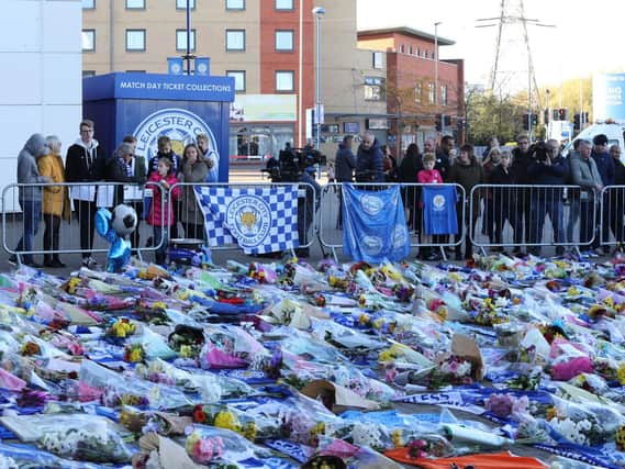 Thousands of floral tributes have been left at Leicester City's King Power Stadium since Saturday's helicopter crash, in which five people - including the club's chairman - died. Photo - SWNS