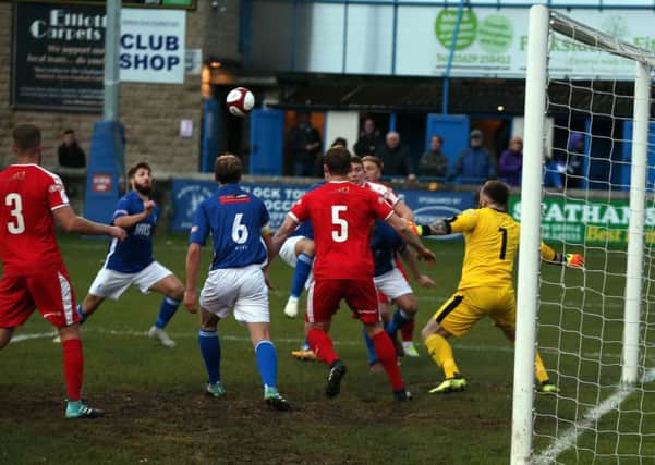 This goalmouth scramble ended with Matlock taking the lead through Craig King. His shot squeezes through the crowd of players.