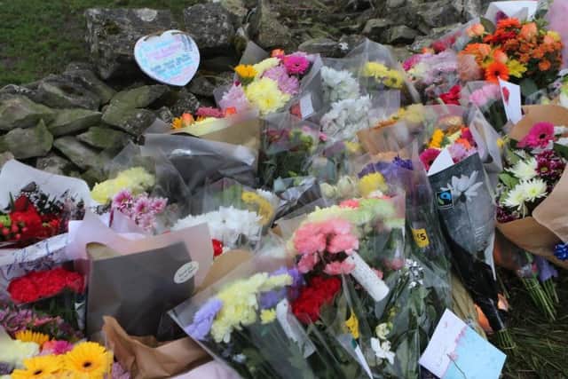 Flowers and tributes left at the crash scene on Friday.